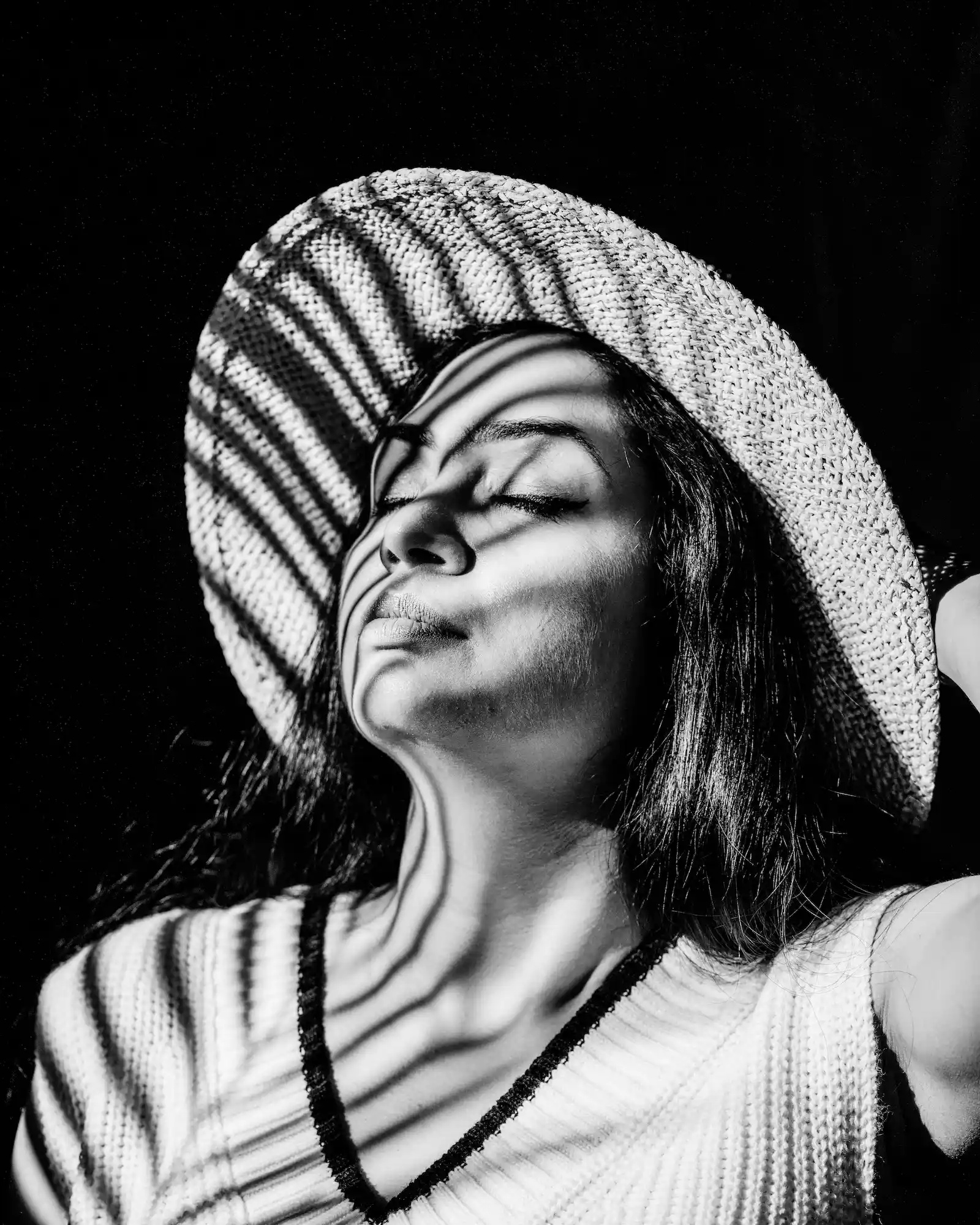 Portrait of a woman in a striped hat (placeholder)