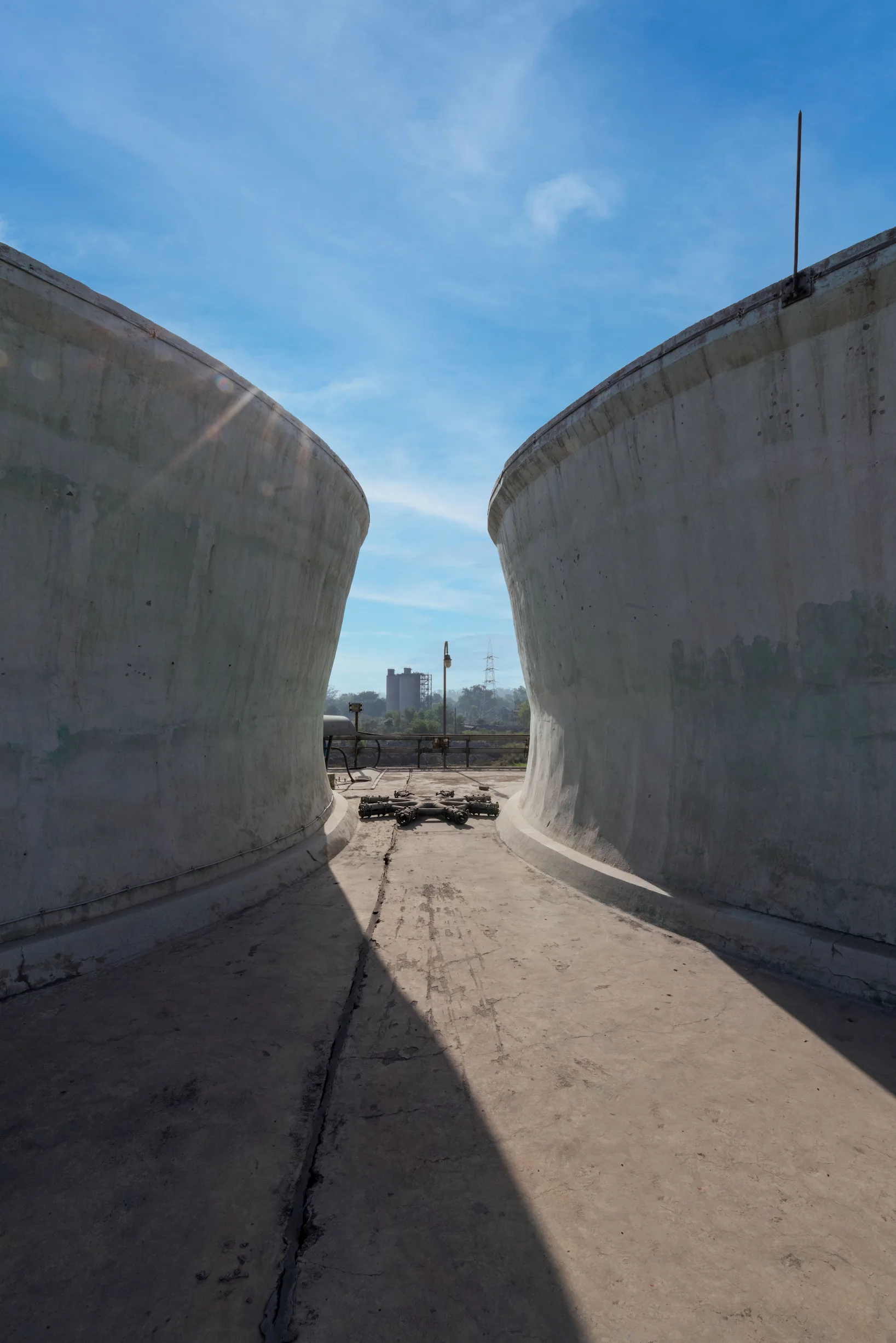 Black and white view between two curved concrete walls (placeholder)